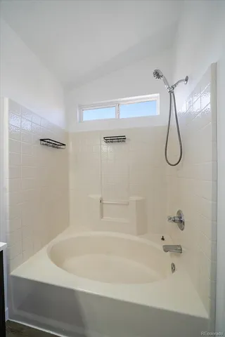a bathroom with a sink toilet vanity and shower