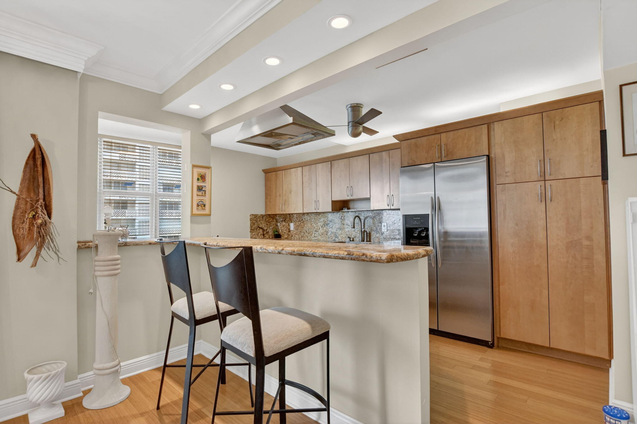 1180 South Ocean Boulevard, Unit 55 Boca Raton, FL 33432 - Photo 11 of 43 kitchen counter pass thru