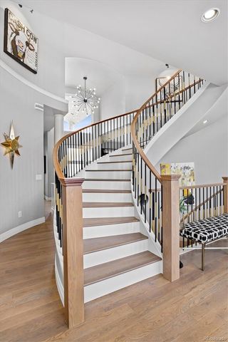 a view of entryway with stairs and wooden floor
