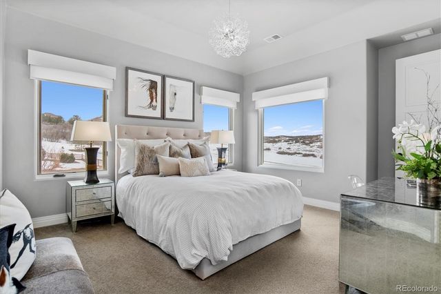 a bed room with bed and a window