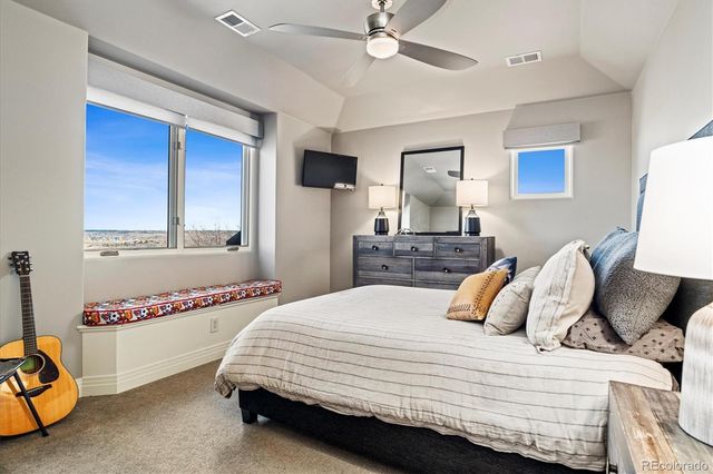 a bedroom with bed and window