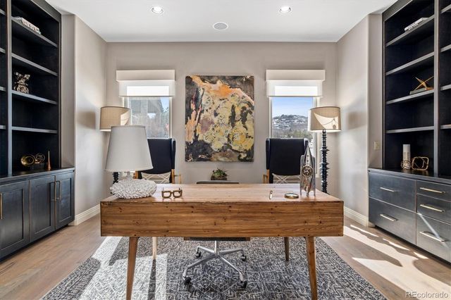 a room with a table chairs and a flat screen tv