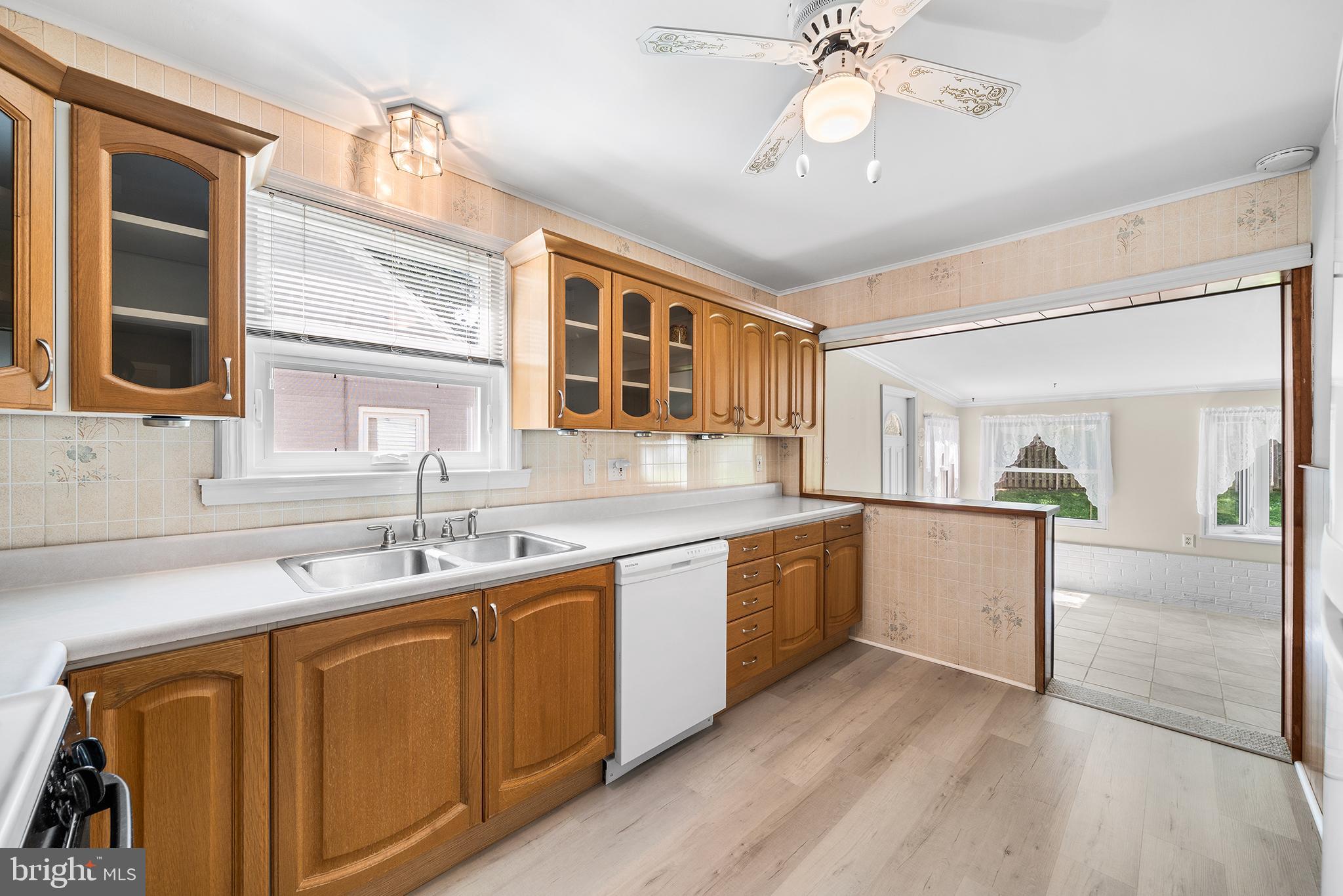 504 Lawrence Road Havertown, PA 19083 - Photo 12 of 20 a kitchen with a sink cabinets and window