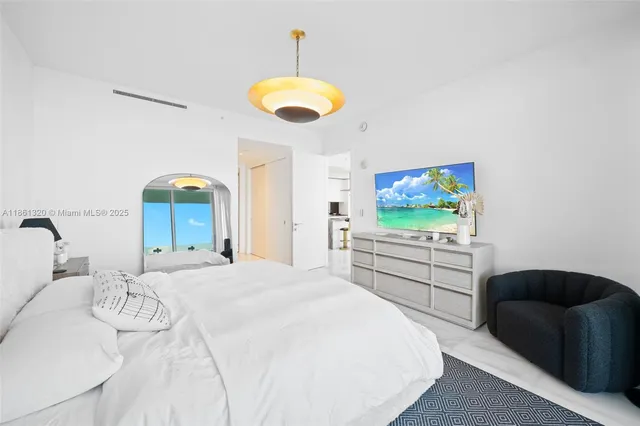 a bathroom with a double vanity sink mirror and shower