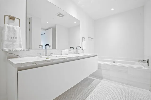 a room with furniture water view and a floor to ceiling window