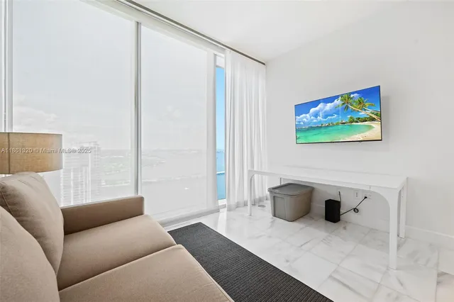 a living room with furniture and a window