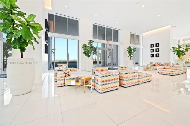 a lobby with furniture and outdoor view