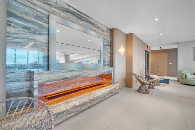 a view of a room that has a table and chairs in it