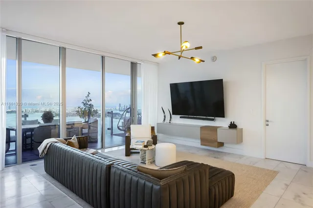 a view of a living room and dining room