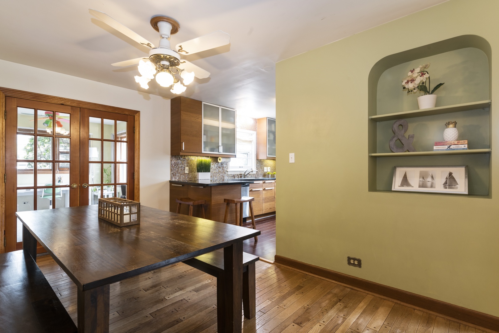 8927 Parkside Avenue Morton Grove, IL 60053 - Photo 5 of 13 a view of a dining room with furniture and chandelier