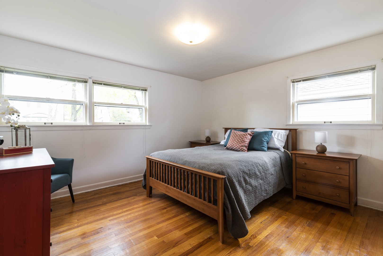 8927 Parkside Avenue Morton Grove, IL 60053 - Photo 7 of 13 a bedroom with a bed and window