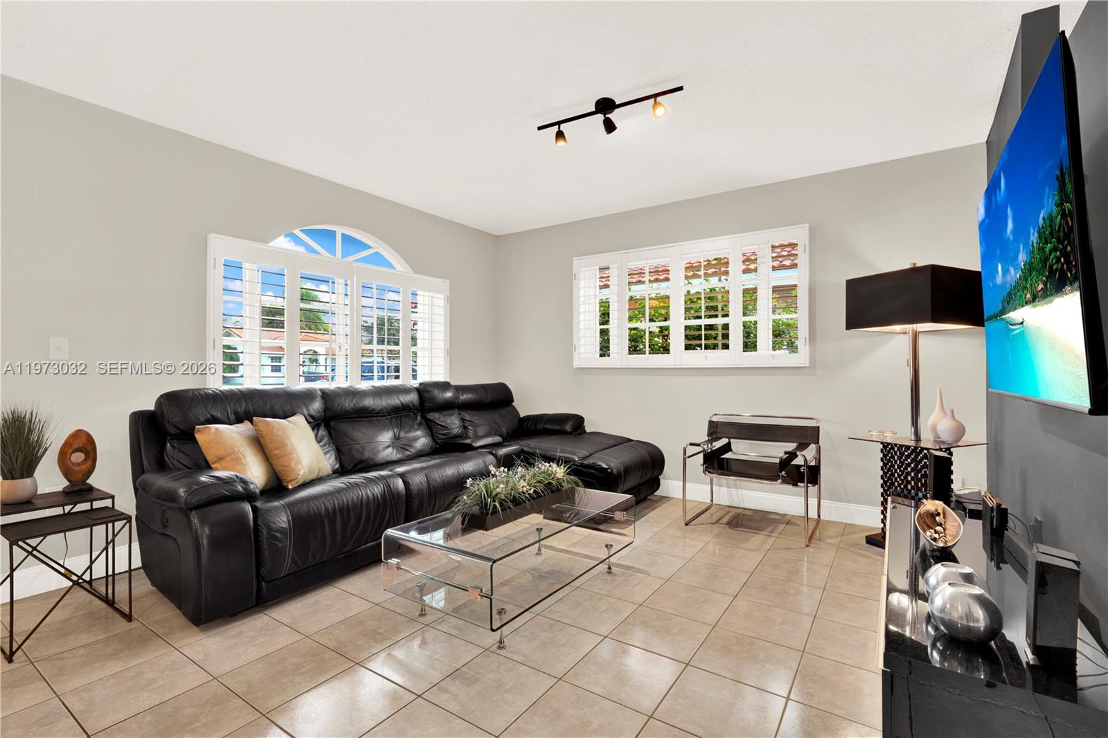 16269 Southwest 78th Terrace Miami, FL 33193 - Photo 12 of 45 a living room with furniture and a window