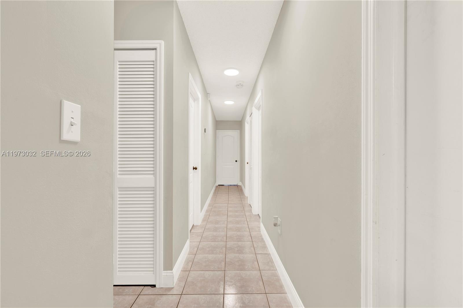 16269 Southwest 78th Terrace Miami, FL 33193 - Photo 20 of 45 a view of a hallway with a white walls