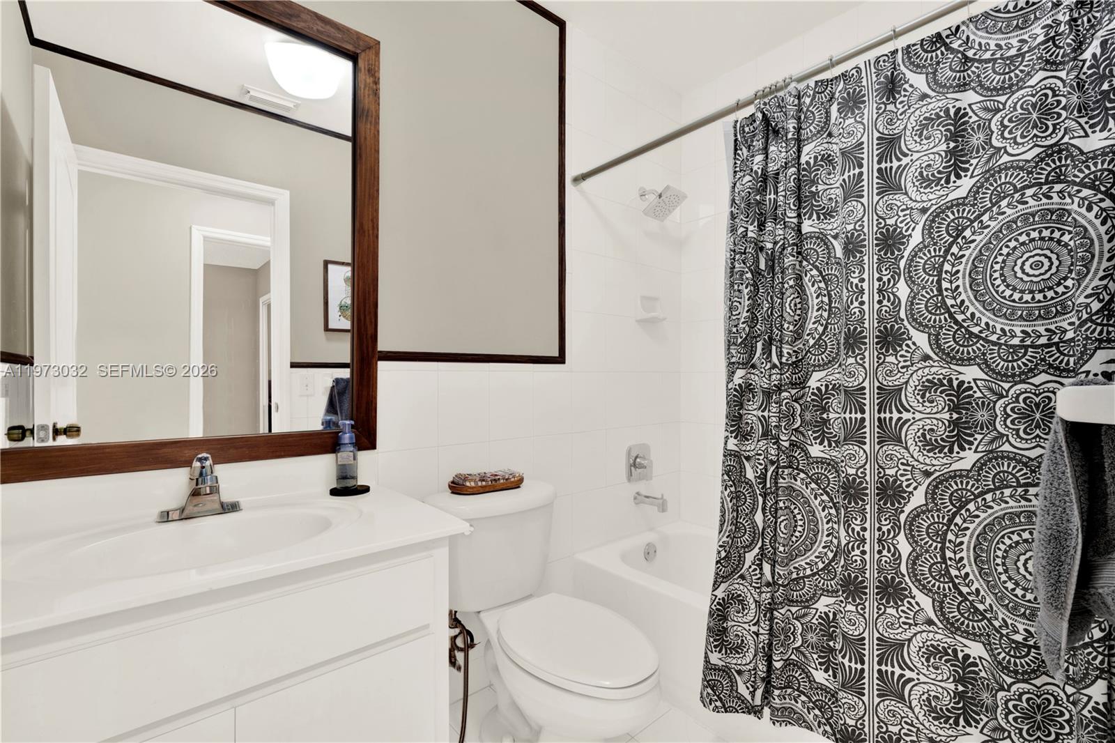 16269 Southwest 78th Terrace Miami, FL 33193 - Photo 24 of 45 a bathroom with a sink toilet and shower