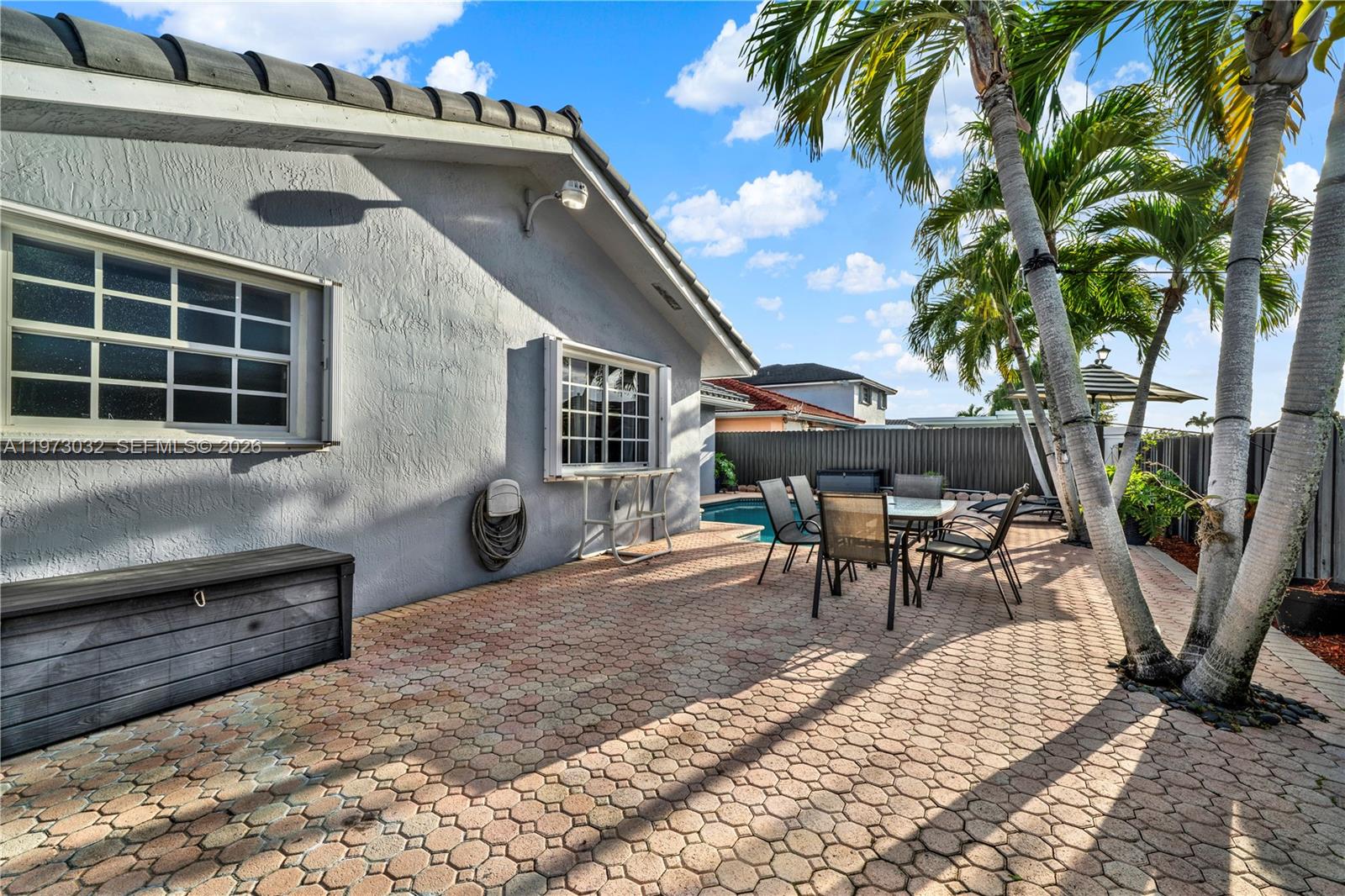 16269 Southwest 78th Terrace Miami, FL 33193 - Photo 27 of 45 a view of a house with backyard and sitting area
