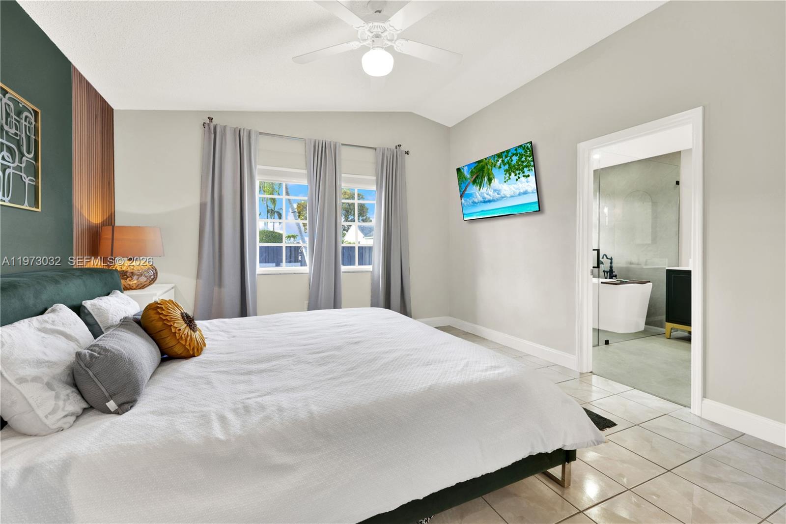 16269 Southwest 78th Terrace Miami, FL 33193 - Photo 5 of 45 a bedroom with a bed and a window