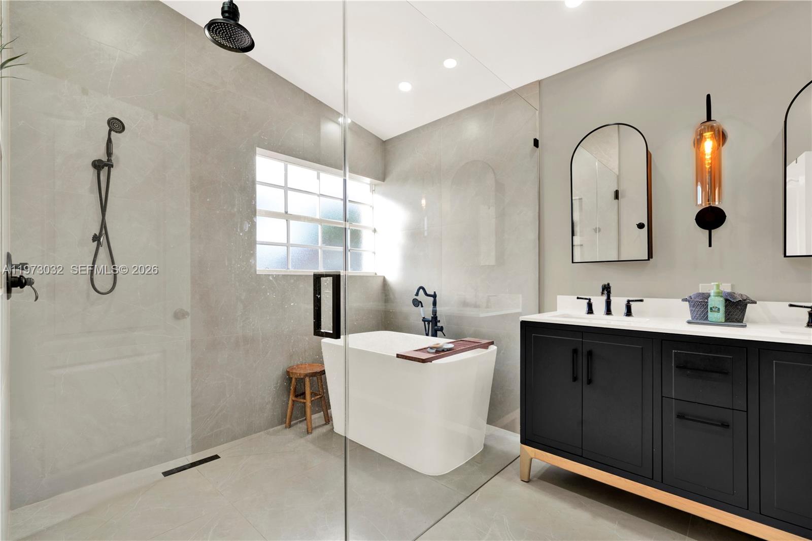 16269 Southwest 78th Terrace Miami, FL 33193 - Photo 6 of 45 a bathroom with a double vanity sink mirror and