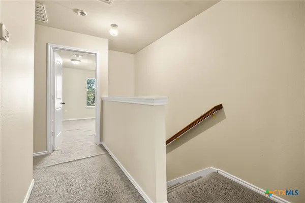 a view of hallway with stairs