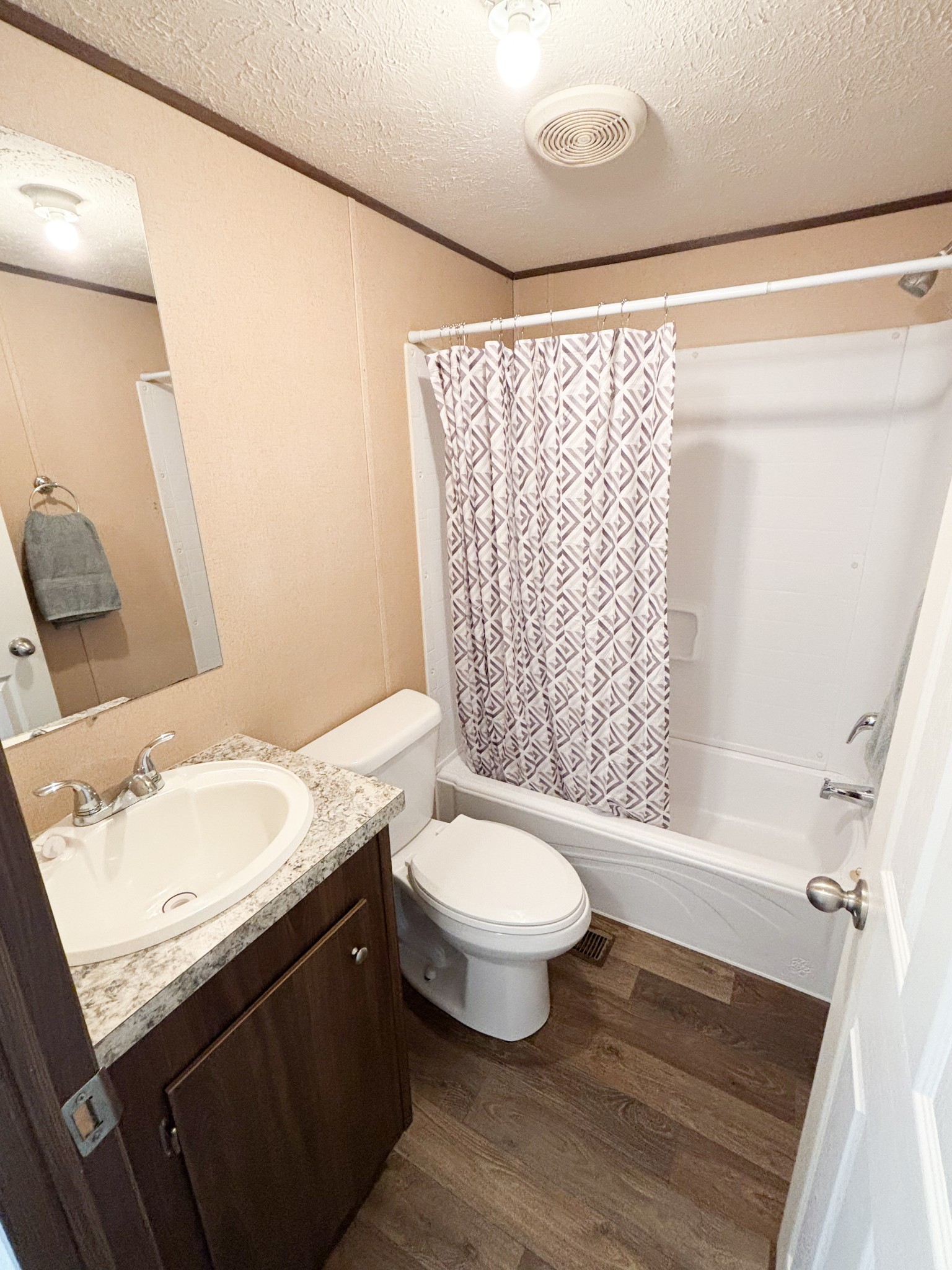 177 Quail Hollow Road Summertown, TN 38483 - Photo 13 of 15 a bathroom with a granite countertop sink toilet and shower