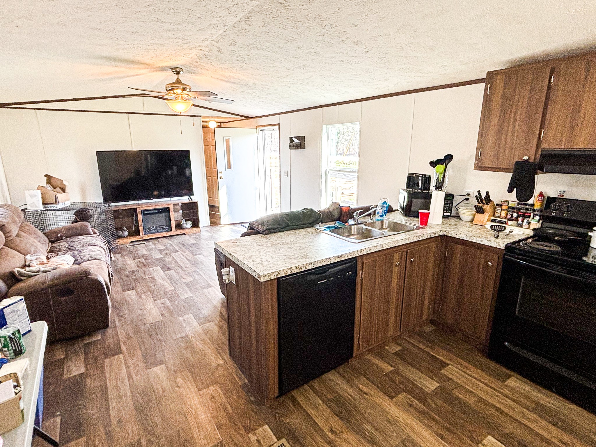 177 Quail Hollow Road Summertown, TN 38483 - Photo 7 of 15 a kitchen with a sink and a stove top oven