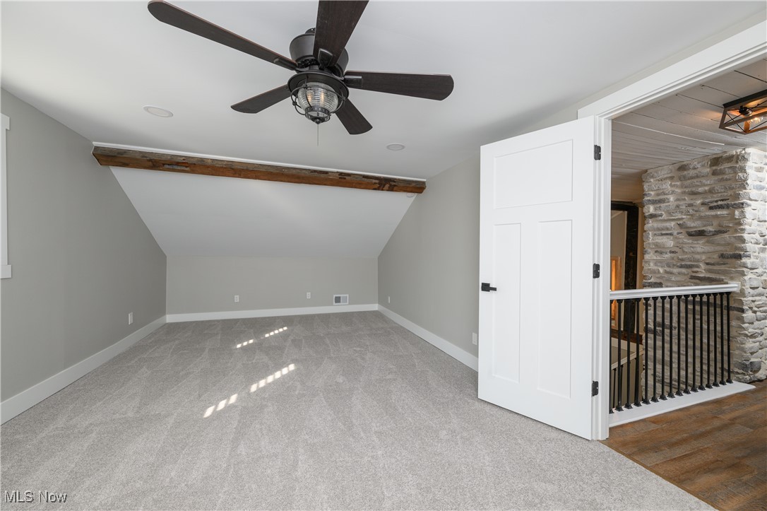 3029 Werner Church Road Northeast Canton, OH 44721 - Photo 18 of 33 Bonus room featuring ceiling fan, vaulted ceiling, and hardwood / wood-style floors
