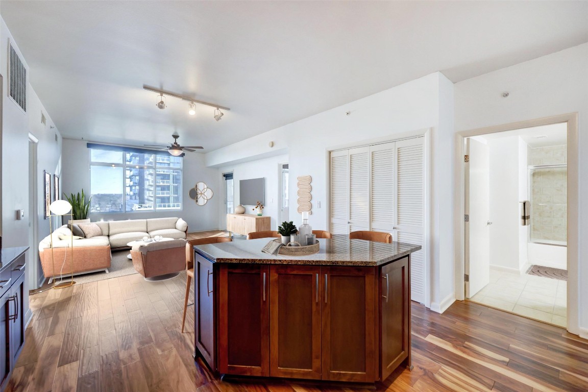 54 Rainey Street, Unit 1013 Austin, TX 78701 - Photo 1 of 1 a dining room with furniture and wooden floor