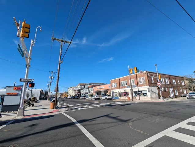 a view of a room with wooden floor and a window