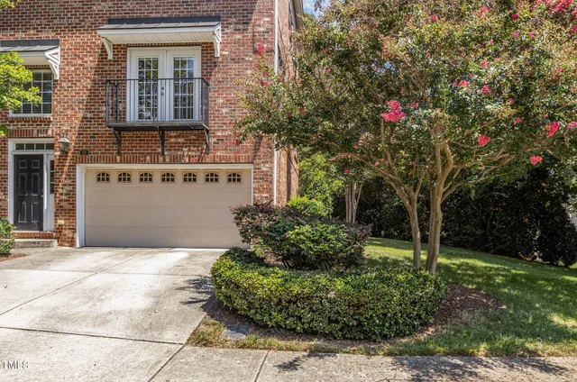 a house view with a sitting space and garden