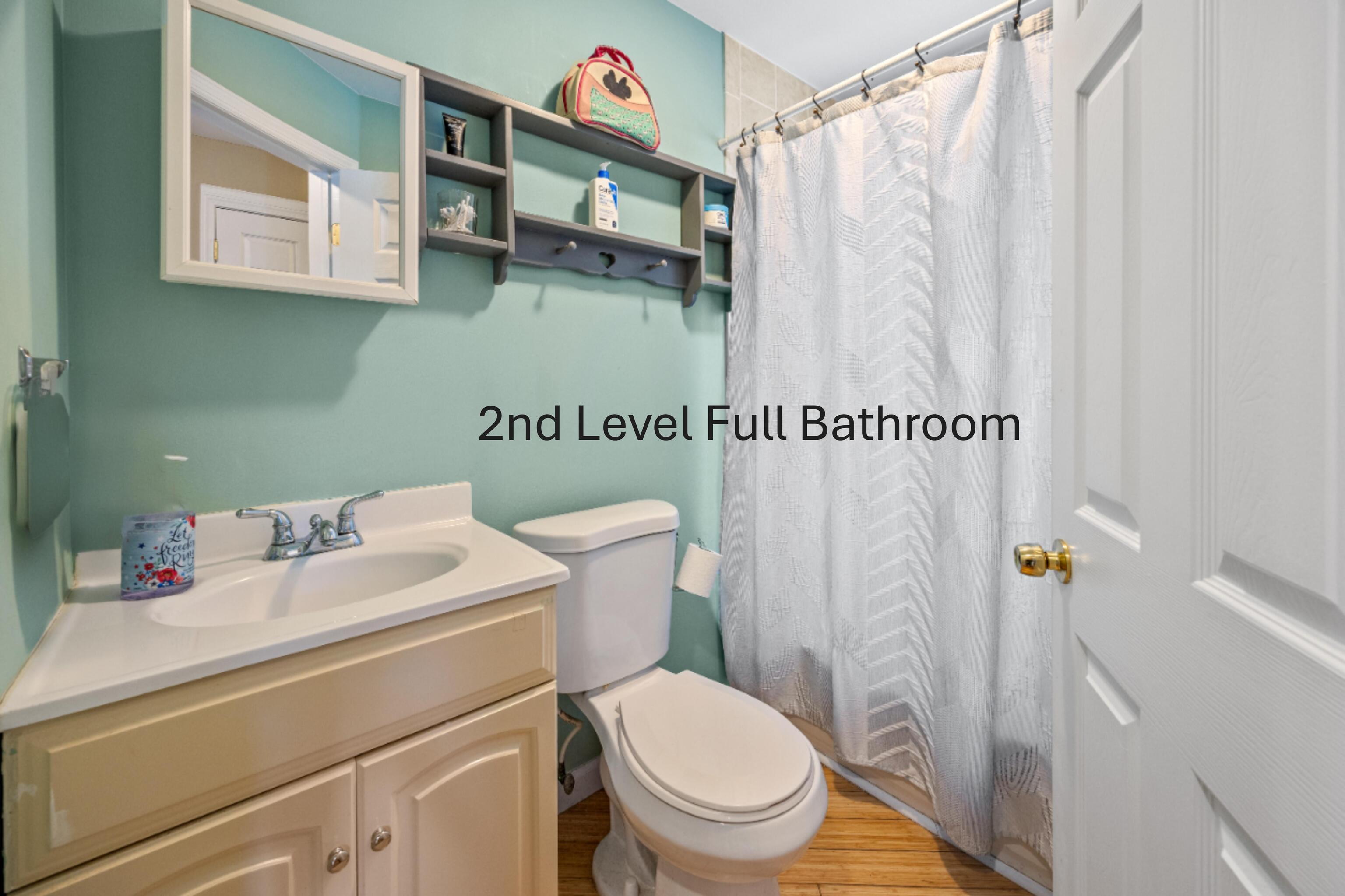 11 Mt Pleasant Street Shelton, CT 06484 - Photo 16 of 23 a white toilet sitting next to a bathroom sink