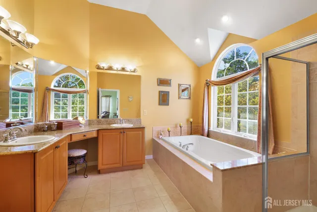 a kitchen with a sink a counter top space and stainless steel appliances