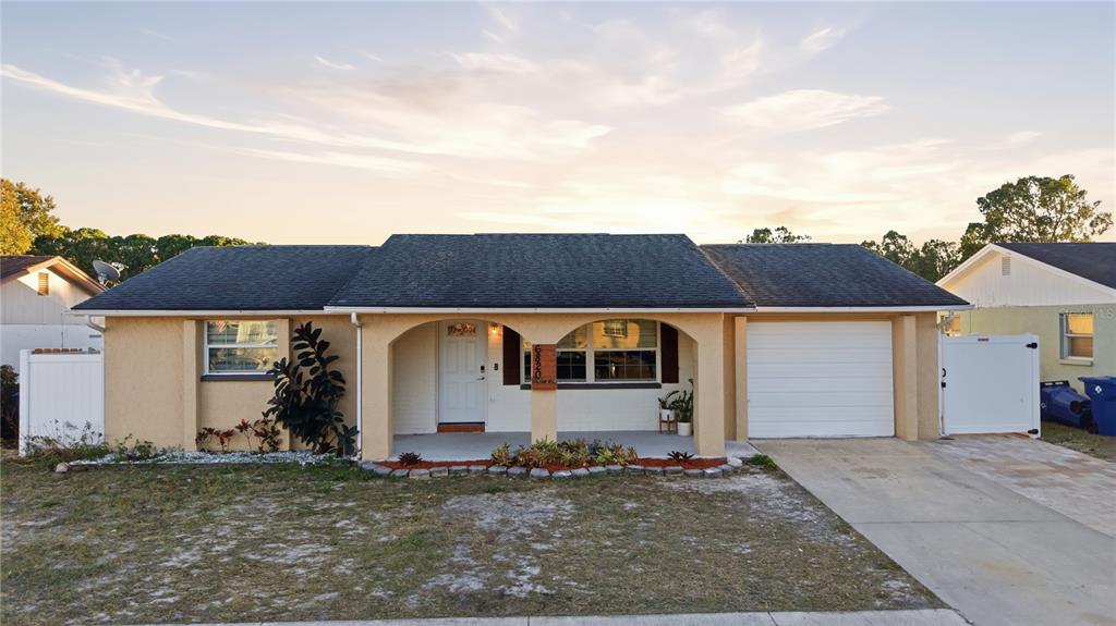 6820 Larchmont Avenue New Port Richey, FL 34653 - Photo 1 of 1 a view of a house with a yard