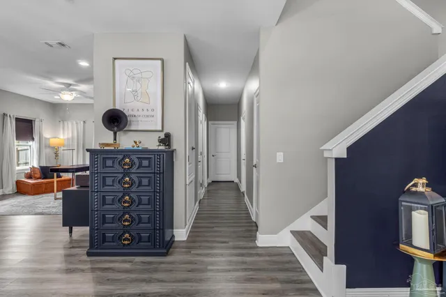 a view of a hallway with the wooden floor