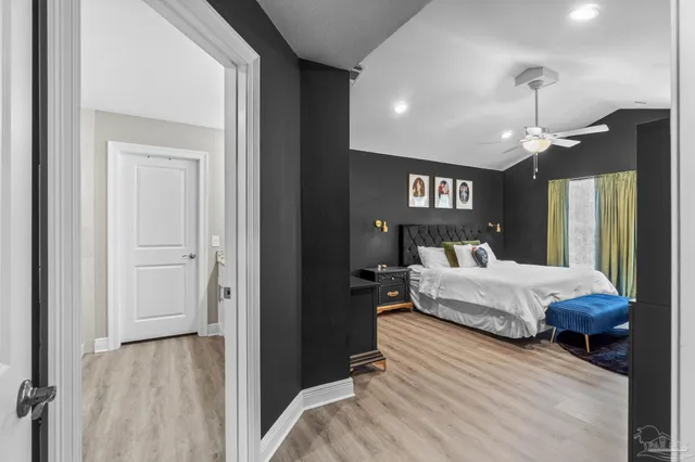 a en suite bathroom with a bed and a chandelier