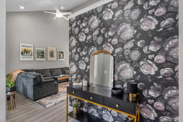 a living room with furniture and wooden floor