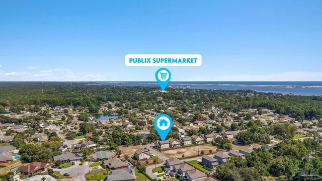a view of a street with a couple of cars parked in front of it