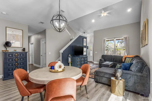 a living room with furniture fireplace and a flat screen tv