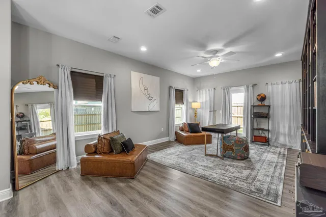 a living room with furniture and a window