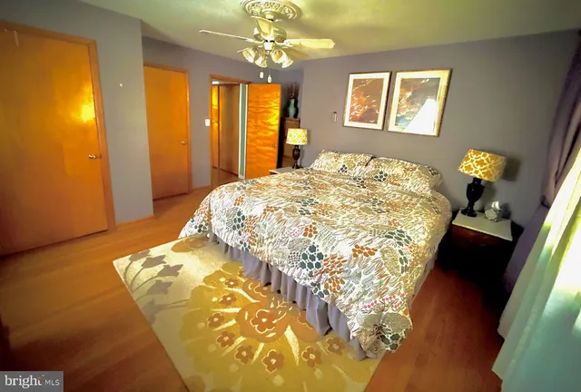 a bedroom with a bed dresser and a window