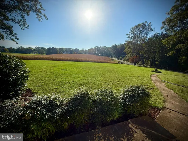 a view of a lake with houses in the back