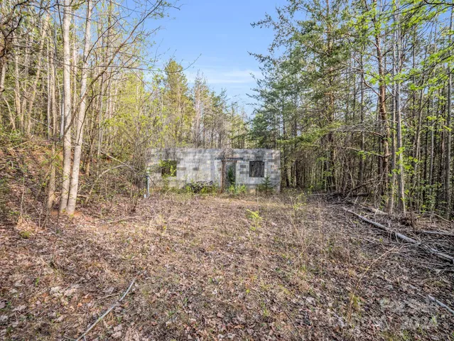 a view of a brick house with a yard