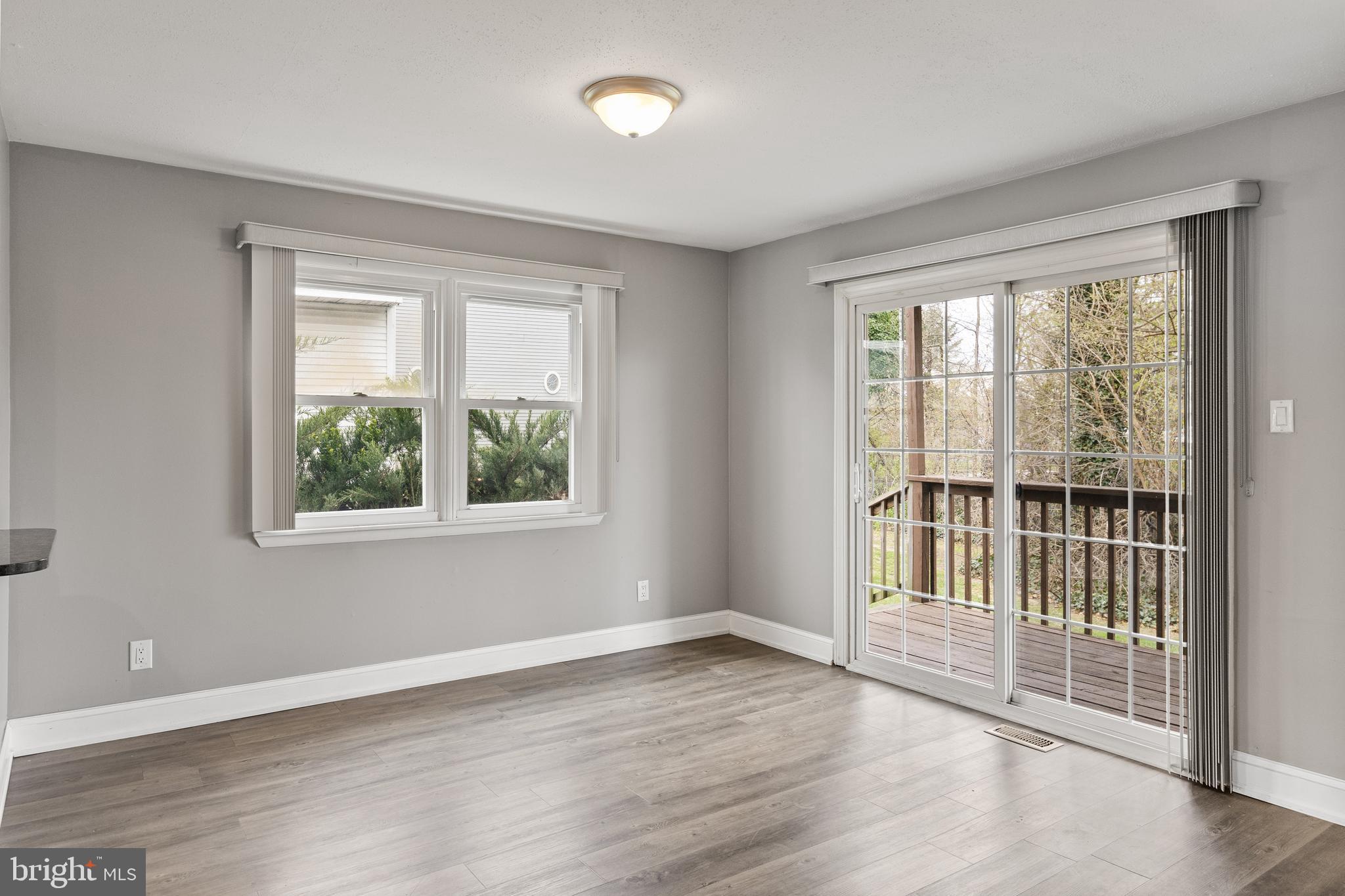 118 Suburban Boulevard Delran, NJ 08075 - Photo 13 of 36 a view of an empty room with wooden floor and a window
