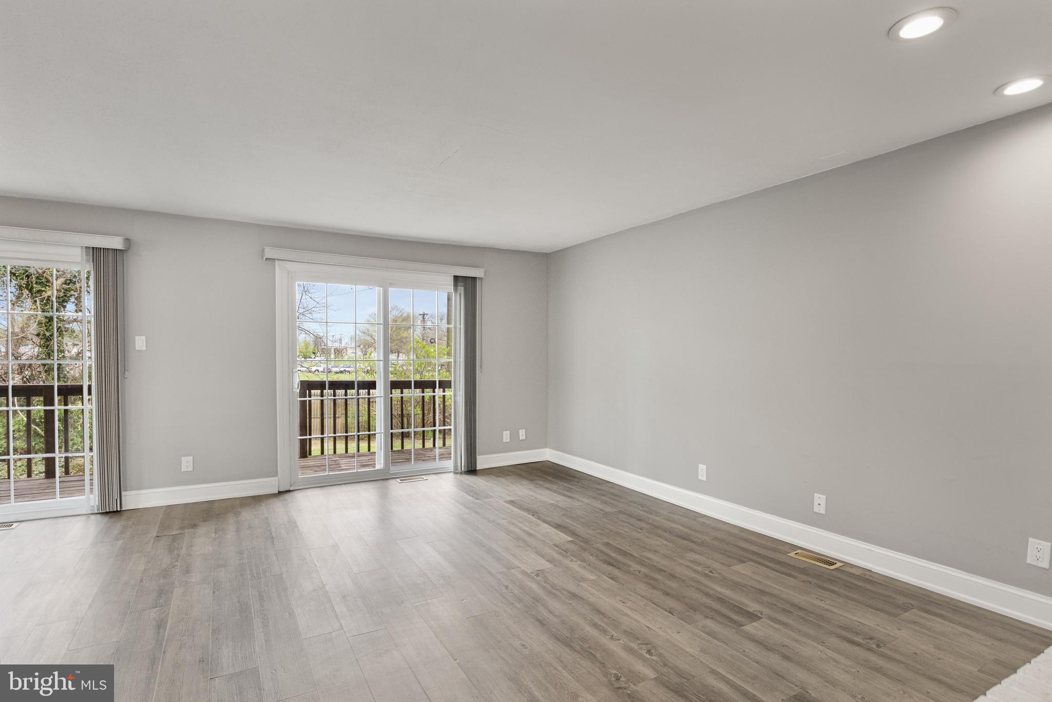 118 Suburban Boulevard Delran, NJ 08075 - Photo 16 of 36 a view of an empty room with wooden floor and a window