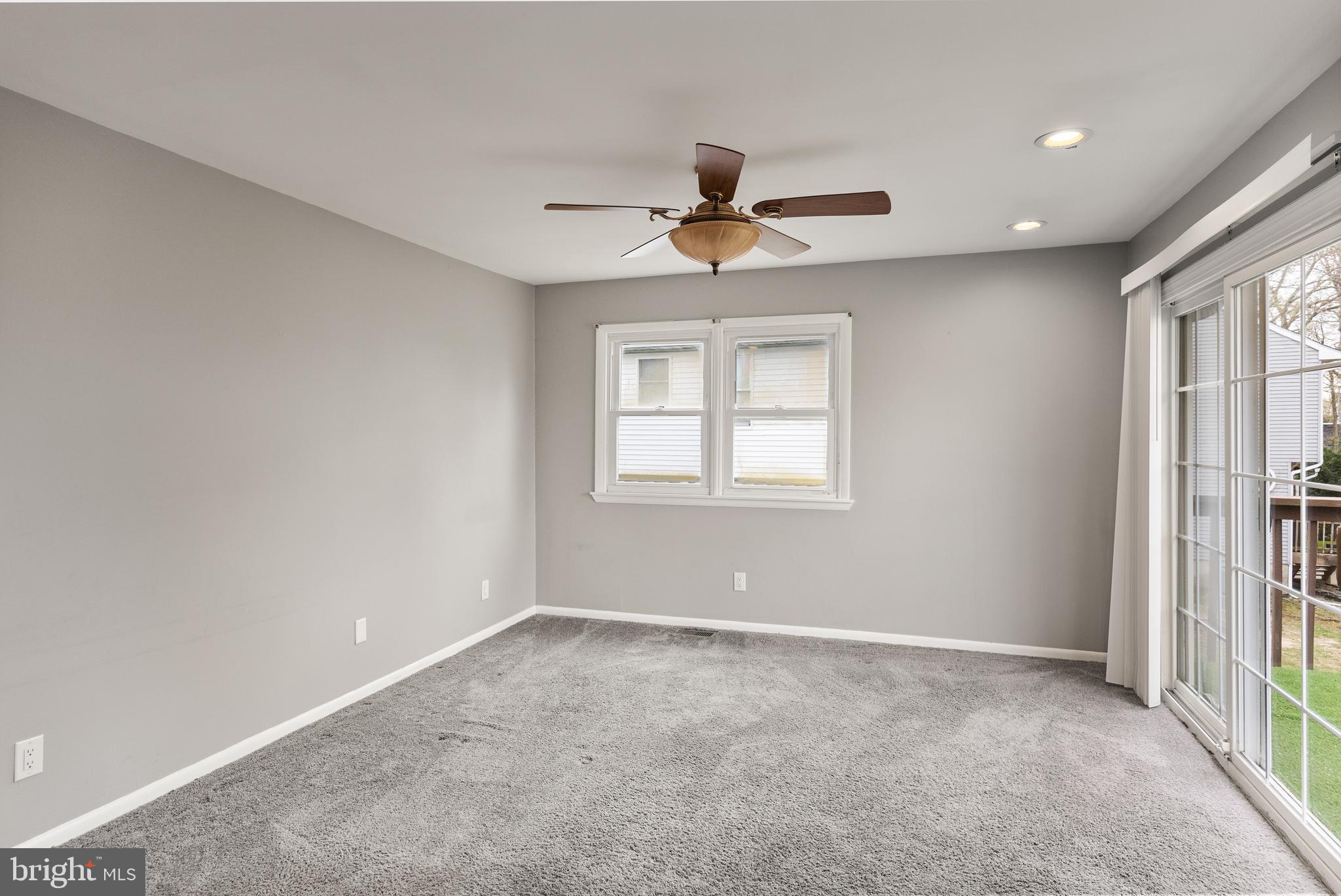 118 Suburban Boulevard Delran, NJ 08075 - Photo 19 of 36 an empty room with windows and fan
