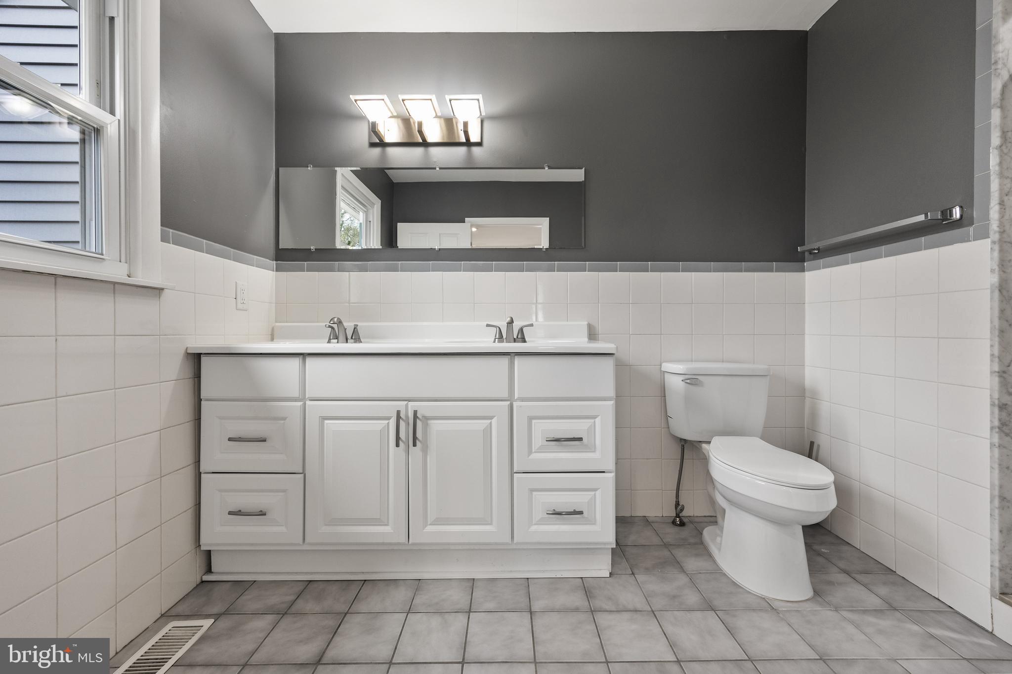 118 Suburban Boulevard Delran, NJ 08075 - Photo 21 of 36 a bathroom with a toilet sink and mirror