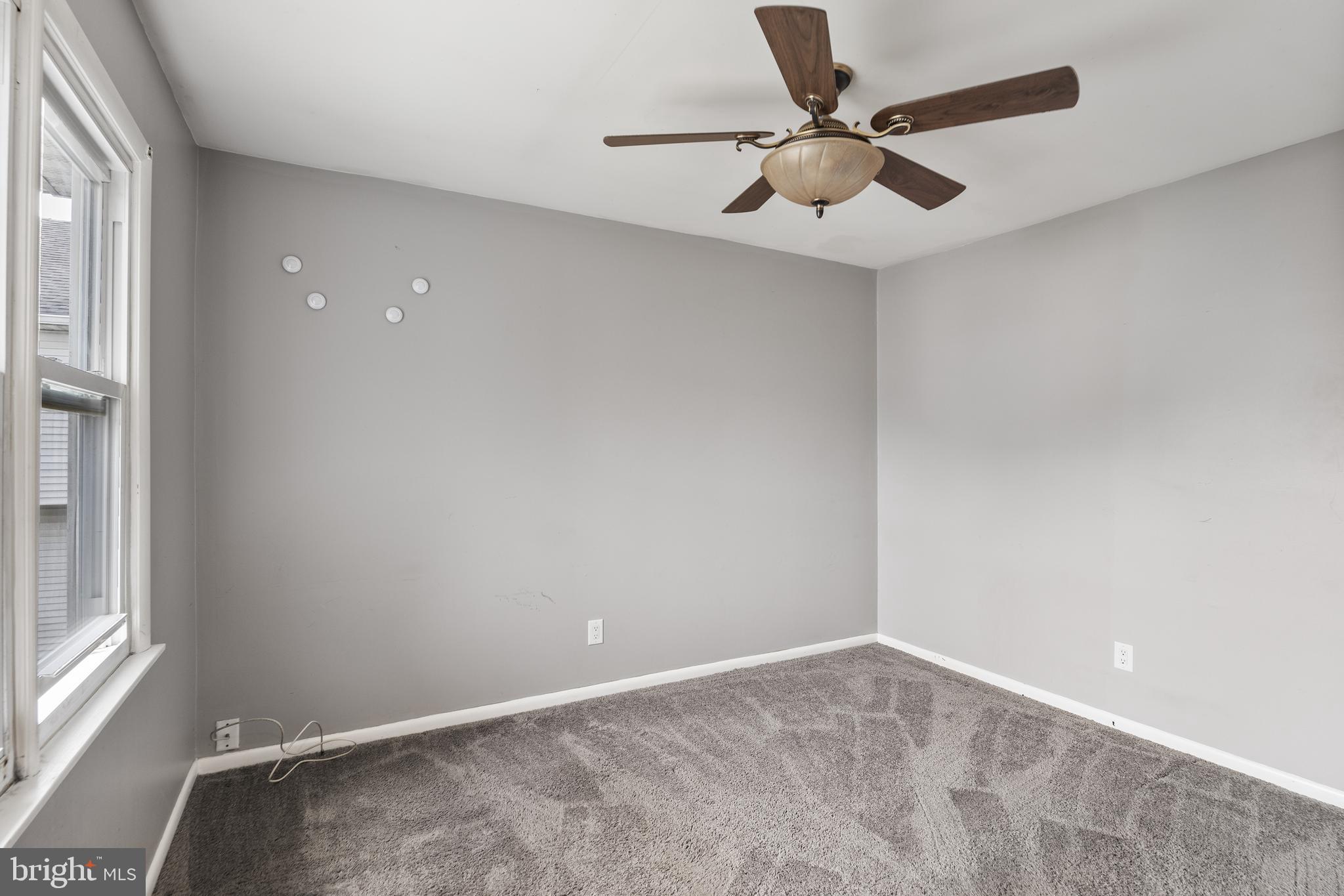 118 Suburban Boulevard Delran, NJ 08075 - Photo 24 of 36 an empty room with a window and a fan