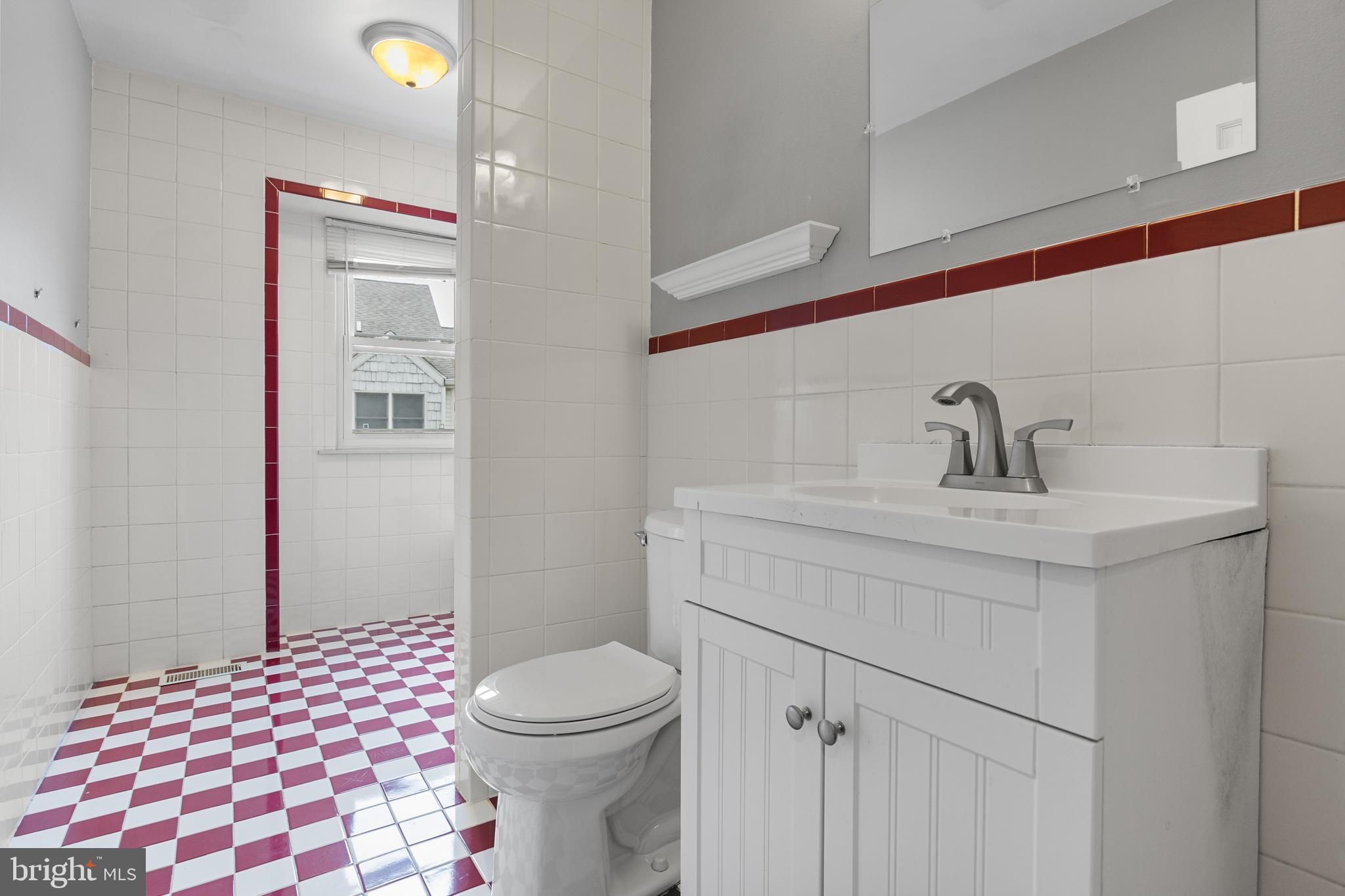 118 Suburban Boulevard Delran, NJ 08075 - Photo 26 of 36 a bathroom with a sink a toilet and shower