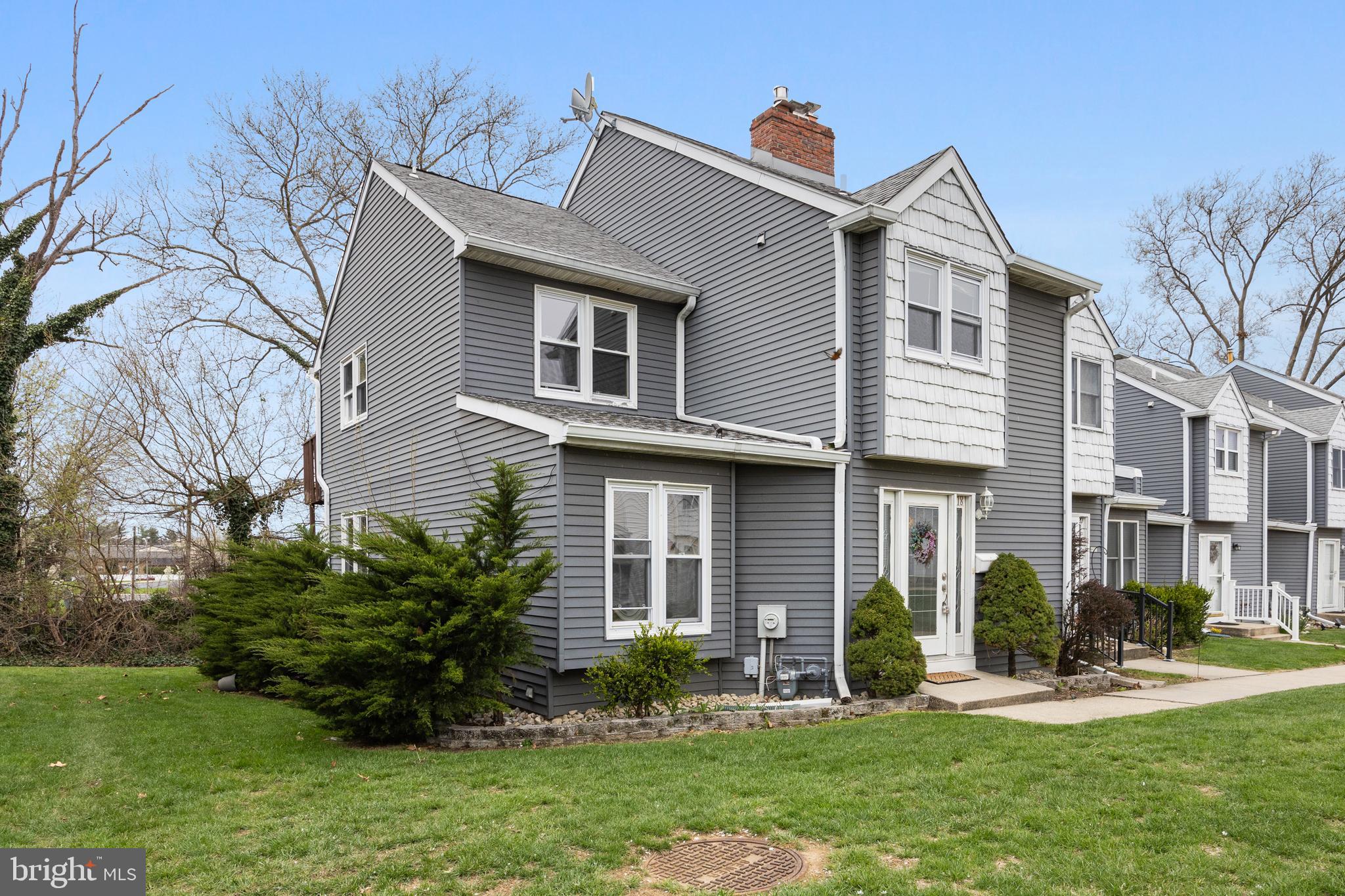 118 Suburban Boulevard Delran, NJ 08075 - Photo 3 of 36 a front view of a house with a yard and porch