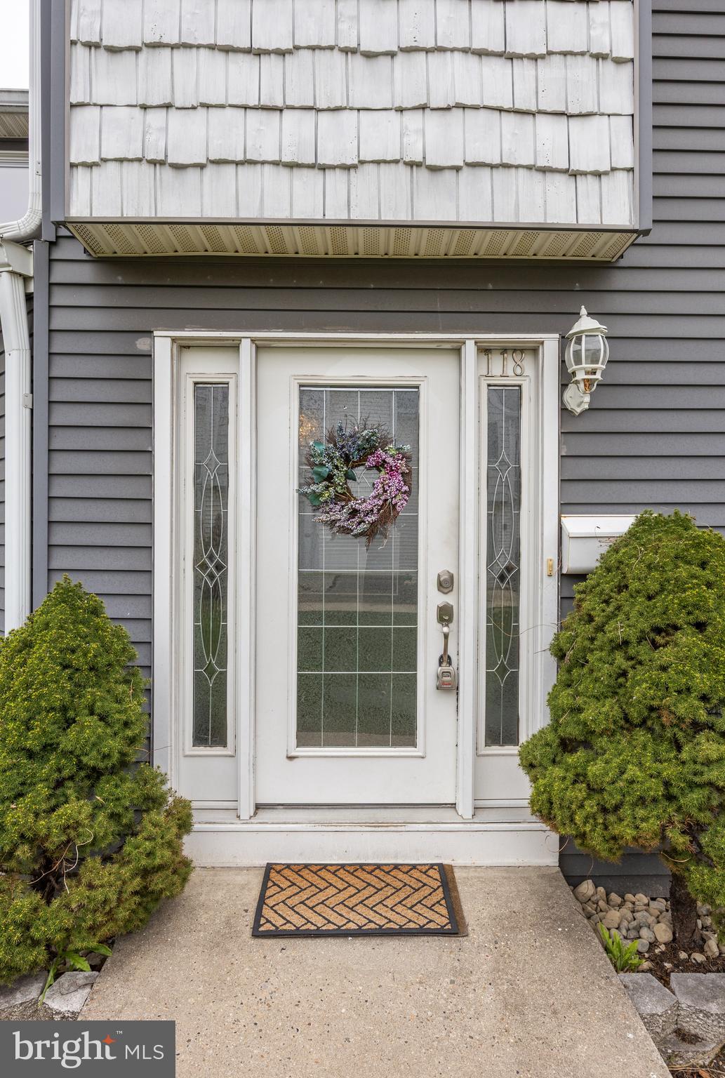 118 Suburban Boulevard Delran, NJ 08075 - Photo 4 of 36 a front view of a house with a garden