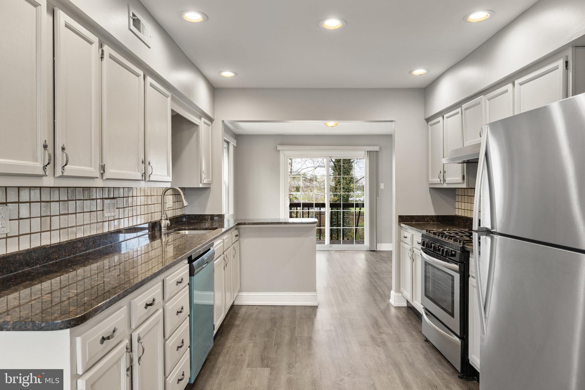118 Suburban Boulevard Delran, NJ 08075 - Photo 6 of 36 a kitchen with stainless steel appliances granite countertop a refrigerator a stove and a sink