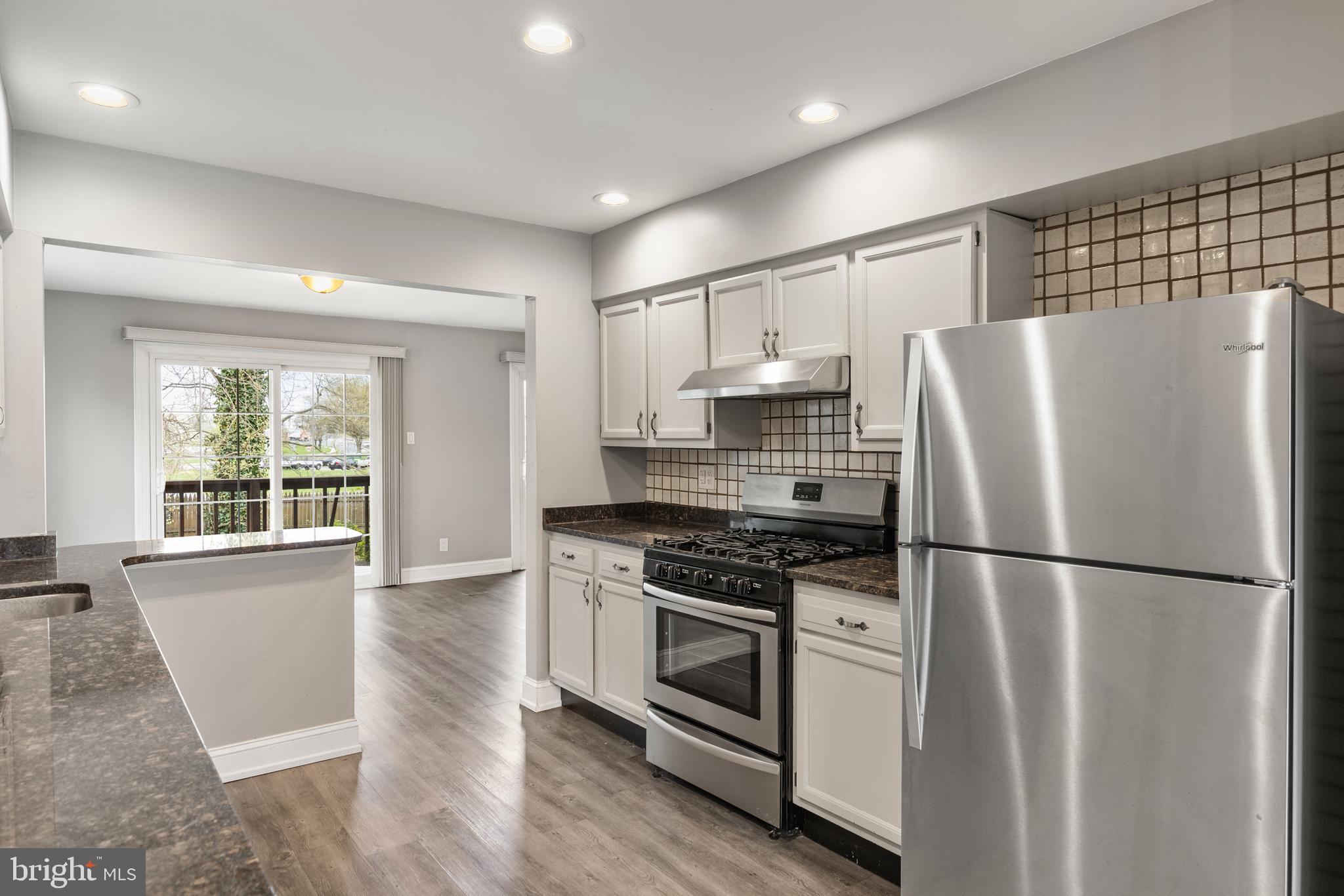 118 Suburban Boulevard Delran, NJ 08075 - Photo 8 of 36 a kitchen with stainless steel appliances a refrigerator sink and cabinets